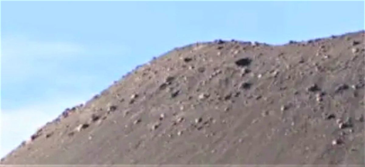Two die after being buried in mound