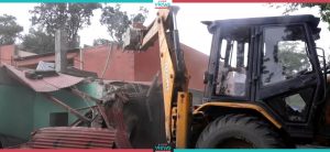 KMC uses dozer to remove illegal structures in Aloknagar