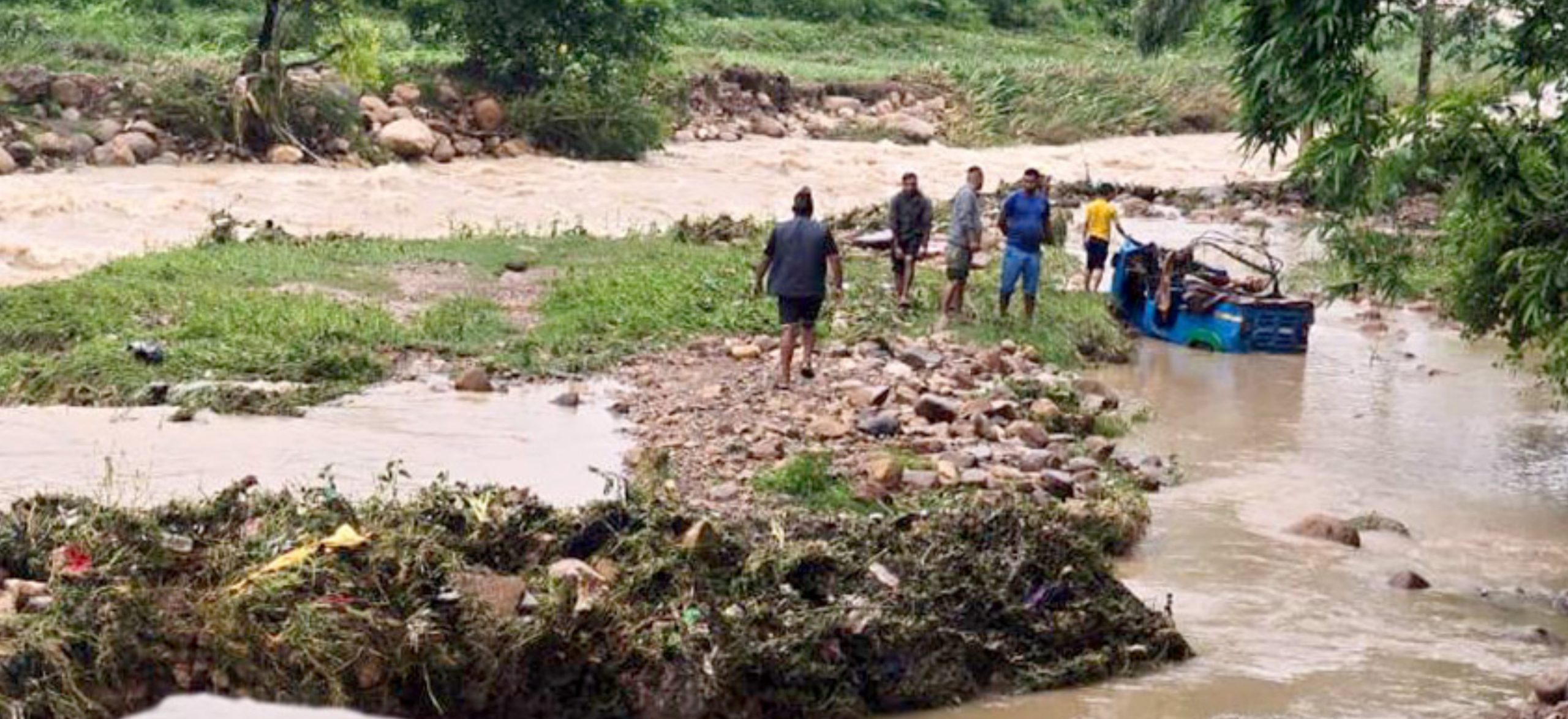 Two missing after being swept away by flood