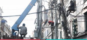 KMC removing New Road premises’ electric poles (Photo Feature)