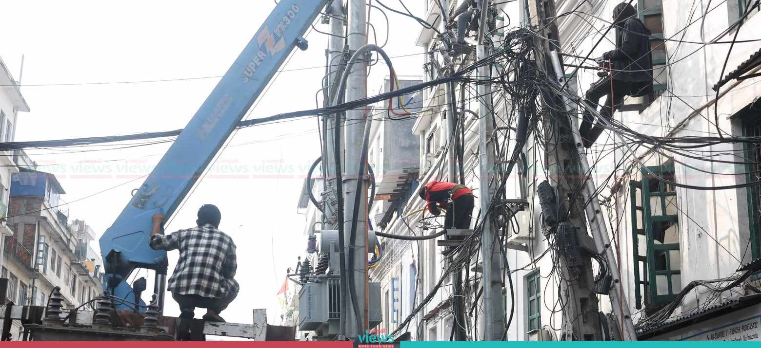 KMC removing New Road premises’ electric poles (Photo Feature)