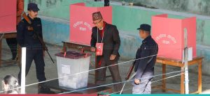 Nepali Congress’s Dangol, candidate of Kirtipur’s Mayor, casts vote (Photo Feature)
