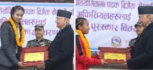 PM Oli hands prizes to medal-winning players of international sports championship